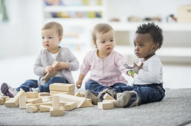 Babies playing together