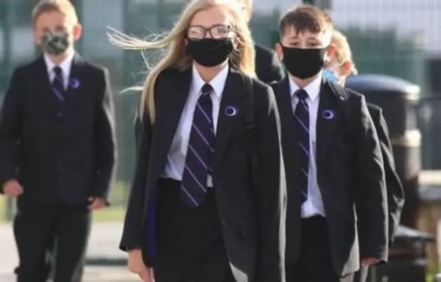 School pupils in wearing masks