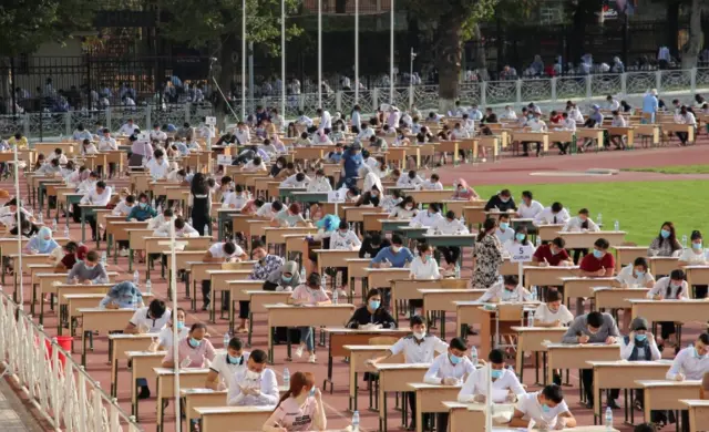 Students take university entrance exams at the Pakhtakor sports arena amid the outbreak of the coronavirus disease in Tashkent, Uzbekistan September 2, 2020