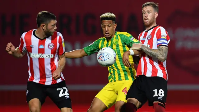 Callum Robinson of West Bromwich Albion is challenged by Henrik Dalsgaard and Pontus Jansson of Brentford