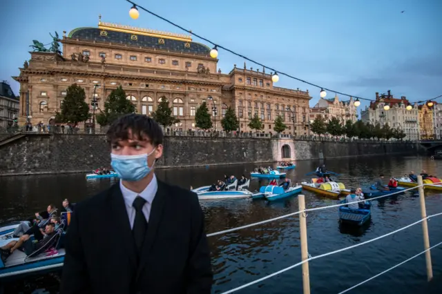 Hundreds of people enjoy a concert on a floating stage on the Vltava river on September 19, 2020, in Prague, Czech Republic