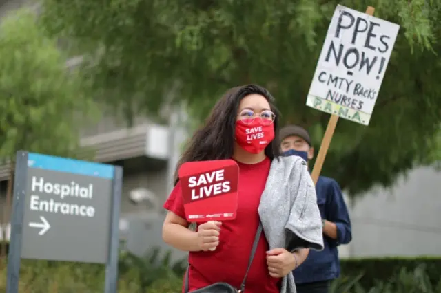 Nurses participate in a national protest for PPE and safer working practices, as the global outbreak of the coronavirus disease continues, in Los Angeles, 5 August, 2020