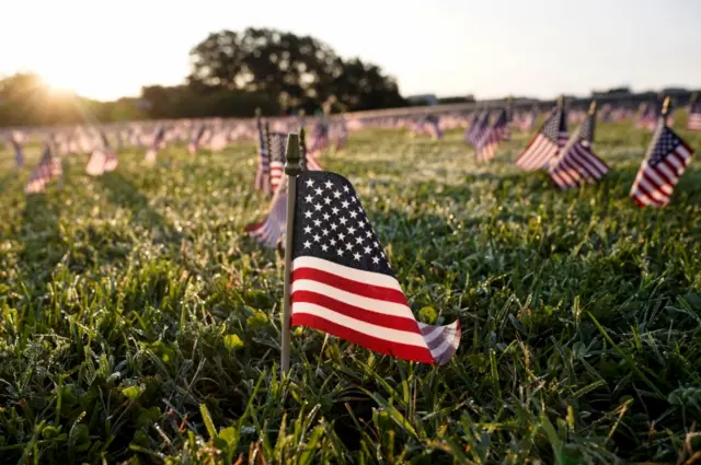 One of 20,000 flags representing the 200,000 lives lost in the United States in the coronavirus disease (COVID-19) pandemic are placed on the National Mall in Washington on 22 September, 2020.