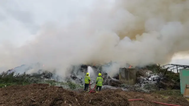 Firefighters and smoke