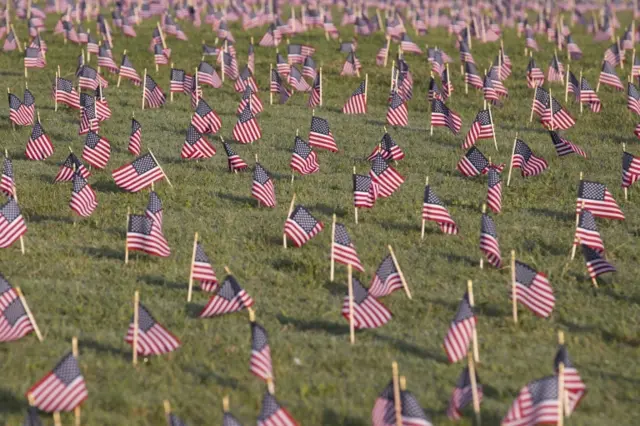 Thousands of US national flags are placed to memorialise Americans