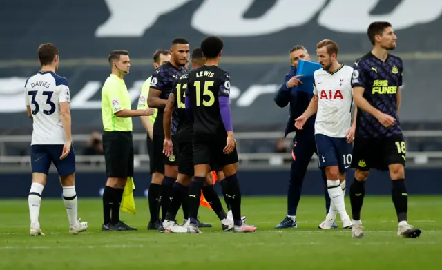 Spurs players and coaches complain to referee Peter Bankes at full-time