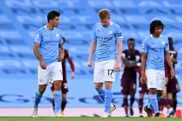 Kevin de Bruyne and Rodri look dejected