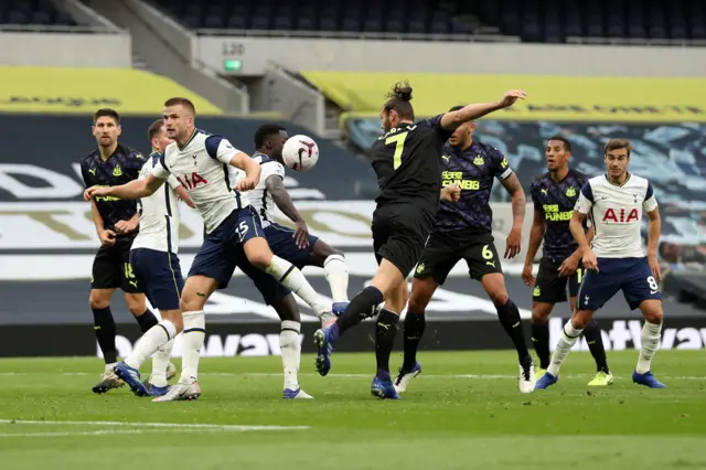 Eric Dier handles Andy Carroll's header to concede a penalty