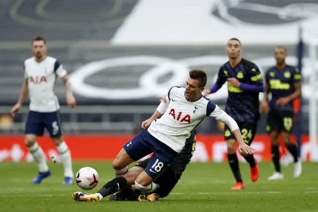 Jonjo Shelvey of Newcastle fouls Tottenham's Giovani Lo Celso