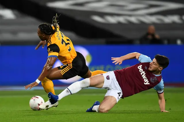 Declan Rice fouls Adama Traore