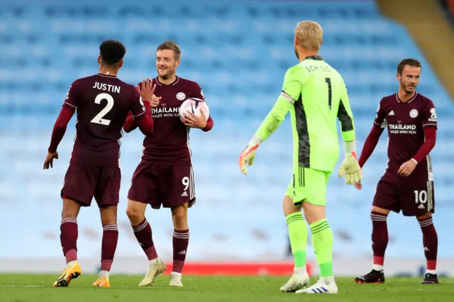 Jamie Vardy celebrates his hat-trick with his Leicester team-mates at full time