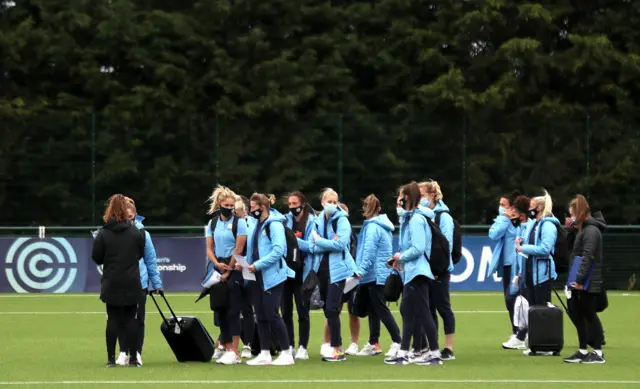 Man City Women wait to have their temperatures taken