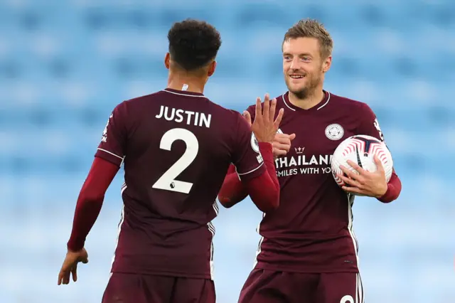 Jamie Vardy celebrates with James Justin