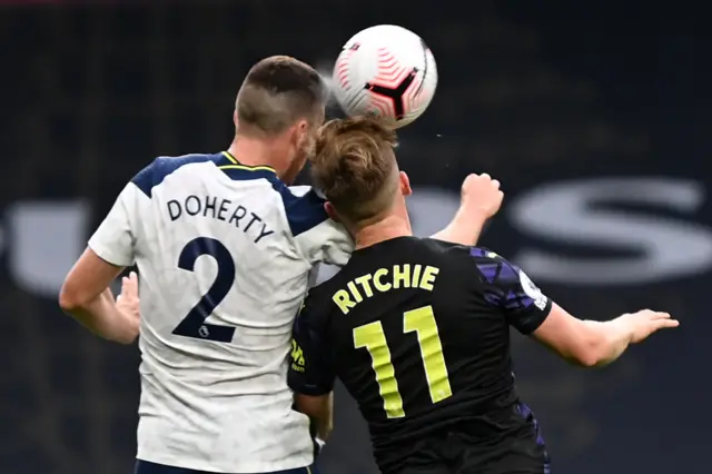 Matt Doherty and Matt Ritchie challenge for the ball