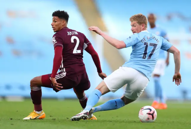 Kevin de Bruyne (R) of Manchester City in action against James Justin of Leicester during the English Premier League match between Manchester City and Leicester Cit