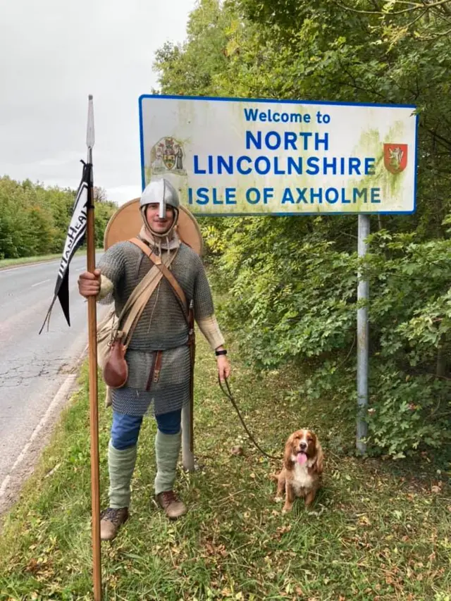 Lewis Kirkbride infront of North Lincolnshire sign