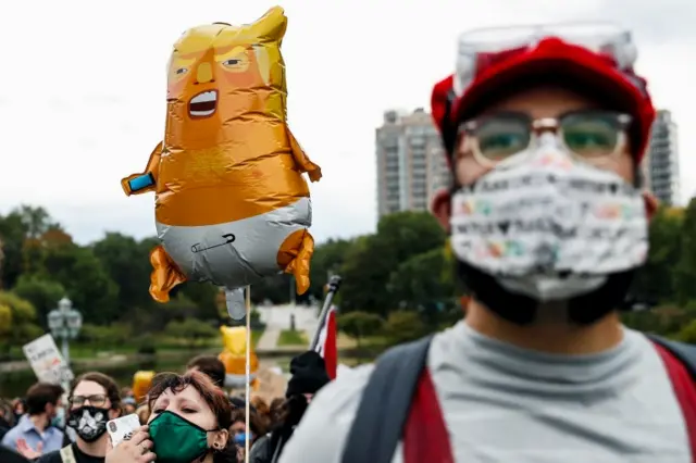 Protestors demonstrate near the venue of the first 2020 presidential campaign debate between U.S. President Donald Trump and Democratic presidential nominee Joe Biden in Cleveland