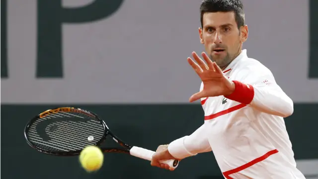 Novak Djokovic hits a forehand