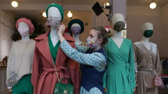 Masks being put on shop dummies in London, UK