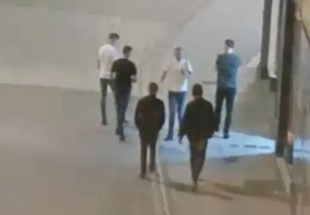 CCTV image of six men