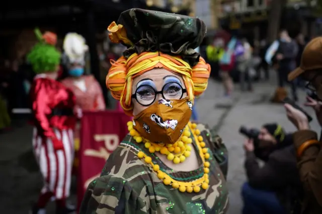 A pantomime dame taking part in the protest