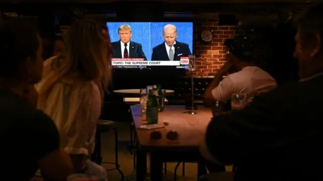 People watch the first presidential debate between Trump and Biden