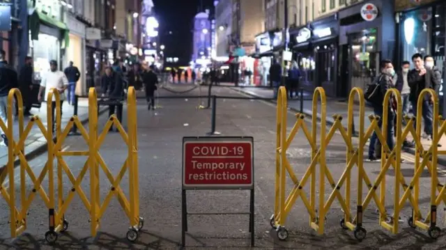 A Covid-19 road sign in a street