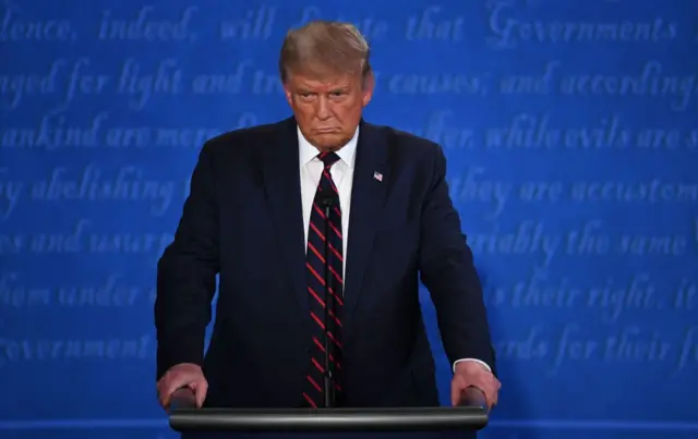 US President Donald Trump looks on during the first presidential debate at Case Western Reserve University and Cleveland Clinic in Cleveland, Ohio, on September 29, 2020