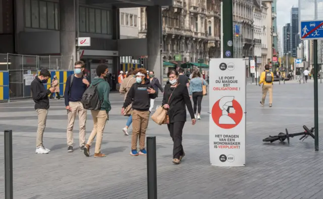 Brussels street with coronavirus safety signs