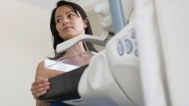 A woman having a breast scan