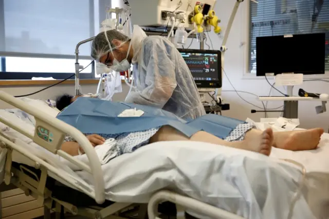 A Covid-19 patient is treated in an intensive care unit in a Paris hospital. File photo