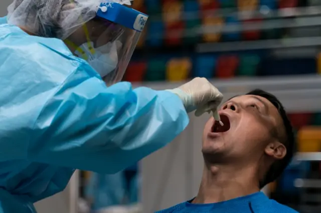 A swab sample is collected from a man during a test for Covid-19 in Hong Kong. Photo: 1 September 2020