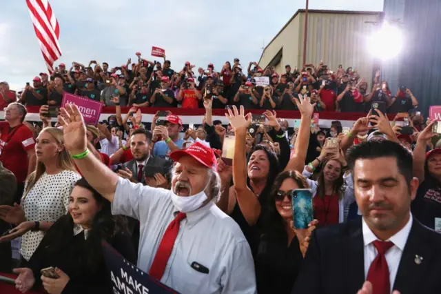 Supporters react as President Trump delivers a campaign speech at Arnold Palmer Regional Airport in Latrobe, Pennsylvania, on 3 September 2020