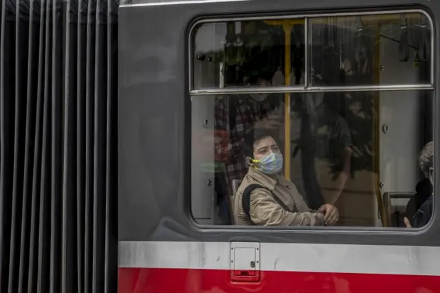 Masked person on bus in Prague on 1 September 2020