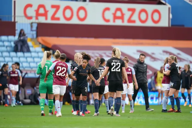 Players shake hands after Aston Villa v Man City