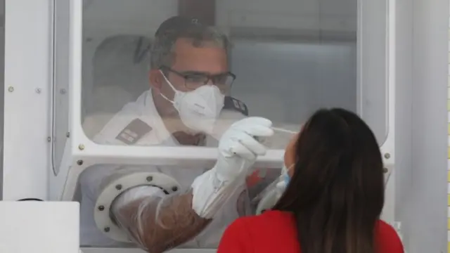 A woman is tested for Covid-19 at a Magen David Adom position in Jerusalem (6 September 2020)