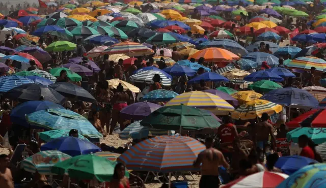 Sunbathers spend a sunny day, without keeping the social distance to prevent the spread of coronavirus, at the Ipanema beach in Rio de Janeiro, Brazil, 06 September 2020.