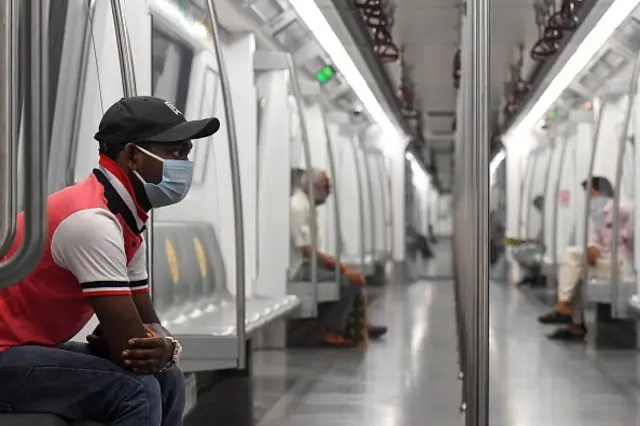 Commuters sit in a carriage of a Yellow Line train after Delhi Metro Rail Corporation (DMRC) resumed services following its closure due to the Covid-19 Coronavirus pandemic in New Delhi on September 7, 2020