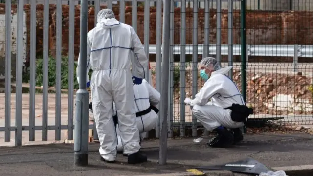 Forensics officers at work in an area