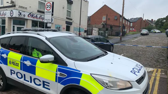 A police car at the scene