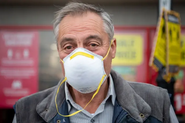 A man wearing a mask in Caerphilly