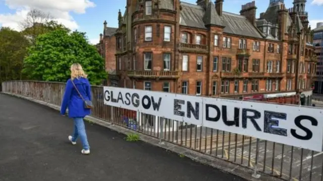 Sign reads: 'Glasgow endures'