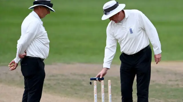 Umpires check light at New Road