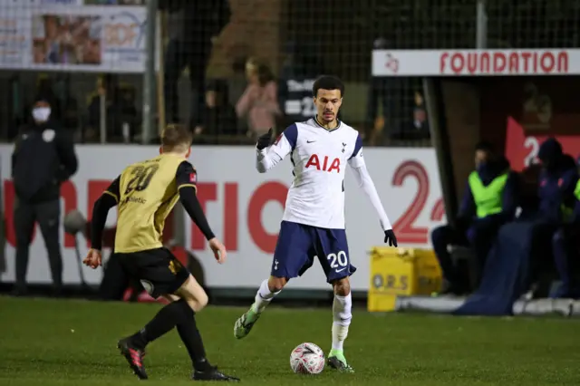 Tottenham Hotspur's English midfielder Dele Alli (R) vies with Marine's English midfielder James Devine (L) during the English FA Cup third round football match between Marine and Tottenham Hotspur at Rossett Park ground in Crosby