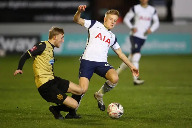 Marine's English midfielder James Barrigan (L) vies with Tottenham Hotspur's English midfielder Harvey White (R) during the English FA Cup third round football match between Marine and Tottenham Hotspur at Rossett Park ground