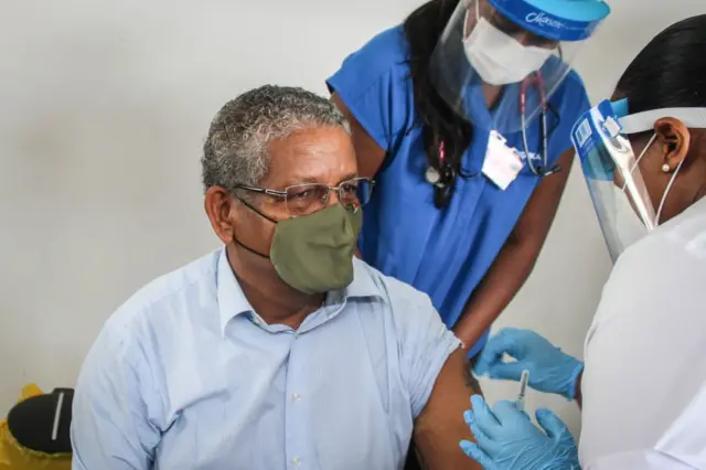 President of Seychelles Wavel Ramkalawan receives the first dose of the Covid-19 vaccine at the Seychelles Hospital in Victoria on January 10, 2021