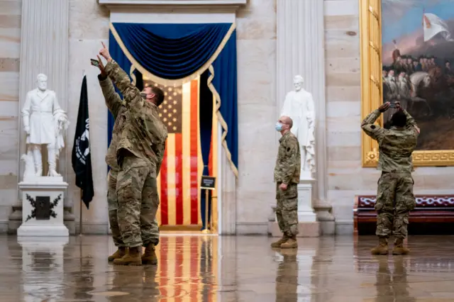 Soldiers wander the halls of Congress