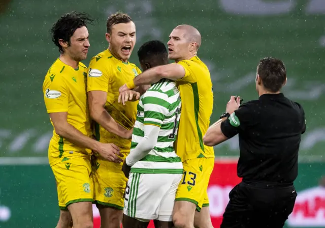 Hibernian's Alex Gogic and Celtic's Ismaila Soro clash at Celtic Park