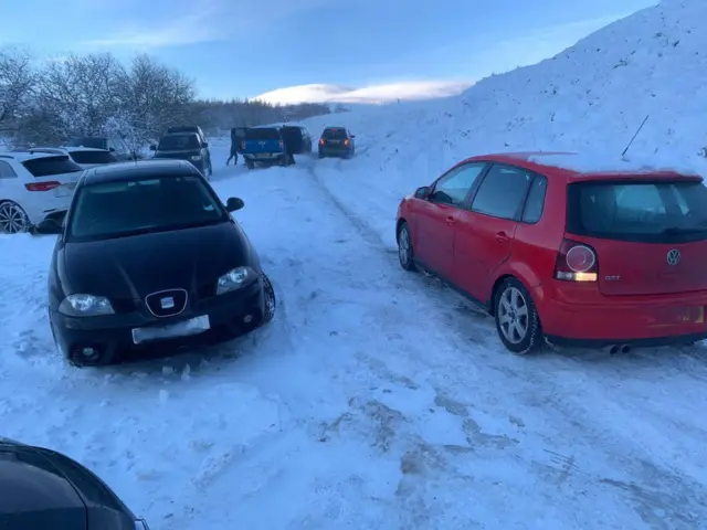 Cars parked in the snow