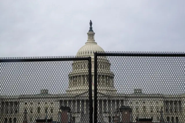 A new 7ft (2.1m) tall metal fence has gone up around Capitol Hill